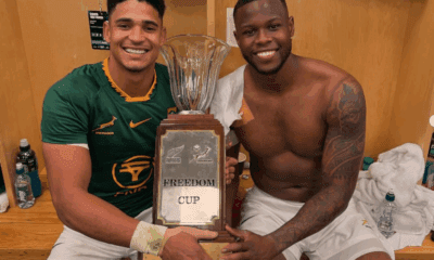 Sasch&Fassi in the locker room holding the Freedom Cup